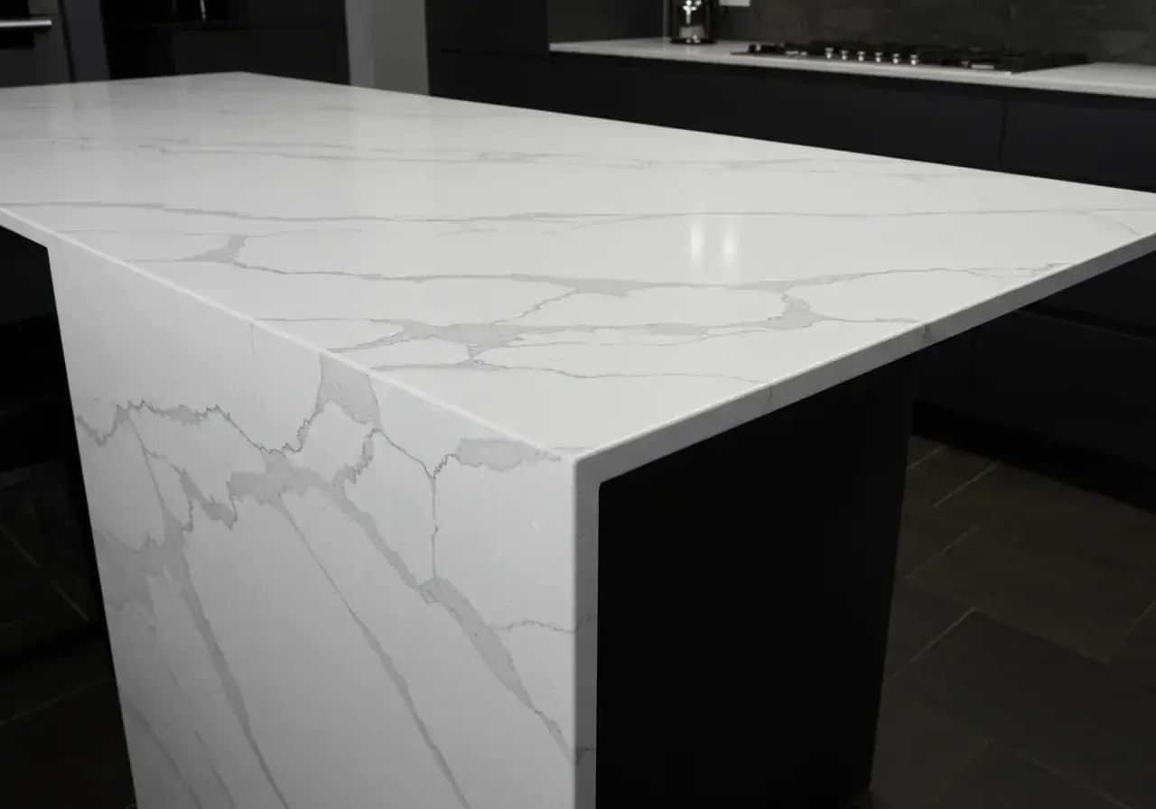 Waterfall edge kitchen island countertop in engineered stone — premium worktop design